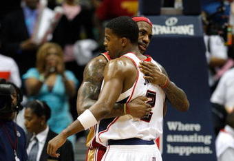 ATLANTA - MAY 11:  LeBron James #23 of the Cleveland Cavaliers hugs Joe Johnson #2 of the Atlanta Hawks after the Cavaliers' 84-74 win in Game Four of the Eastern Conference Semifinals during the 2009 NBA Playoffs at Philips Arena on May 11, 2009 in Atlanta, Georgia.  NOTE TO USER: User expressly acknowledges and agrees that, by downloading and/or using this Photograph, user is consenting to the terms and conditions of the Getty Images License Agreement.  (Photo by Andy Lyons/Getty Images)