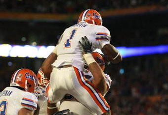 MIAMI - JANUARY 08:  Percy Harvin #1 of the Florida Gators celebrates with teammates after he scored a 2-yard rushing touchdown in the third quarter against the Oklahoma Sooners during the FedEx BCS National Championship game at Dolphin Stadium on January 8, 2009 in Miami, Florida.  (Photo by Doug Benc/Getty Images)