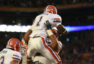 MIAMI - JANUARY 08:  Percy Harvin #1 of the Florida Gators celebrates with teammates after he scored a 2-yard rushing touchdown in the third quarter against the Oklahoma Sooners during the FedEx BCS National Championship game at Dolphin Stadium on January 8, 2009 in Miami, Florida.  (Photo by Doug Benc/Getty Images)