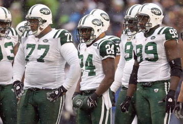 SEATTLE - DECEMBER 21:  Darrelle Revis #24 of the New York Jets stands with teammates during the game against the Seattle Seahawks on December 21, 2008 at Qwest Field in Seattle, Washington. The Seahawks defeated the Jets 13-3. (Photo by Otto Greule Jr/Getty Images)