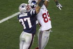 GLENDALE, AZ - FEBRUARY 03:  David Tyree #85 of the New York Giants catches a 32-yard pass from Eli Manning #10 as Rodney Harrison #37 of the New England Patriots attempts to knock it out in the fourth quarter of Super Bowl XLII on February 3, 2008 at the University of Phoenix Stadium in Glendale, Arizona.  (Photo by Jim McIsaac/Getty Images)