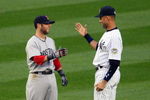 NEW YORK - MAY 05:  Derek Jeter #2 of the New York Yankees talks with Dustin Pedroia #15 of the Boston Red Sox prior to their game on May 5, 2009 at Yankee Stadium in the Bronx borough of New York City. The Red Sox defeated the Yankees 7-3. (Photo by Jim McIsaac/Getty Images)