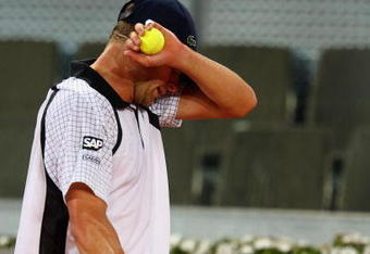 MADRID, SPAIN - MAY 13:  Andy Roddick of the USA shows his dejection against Tommy Haas of Germany in their second round  match during the Madrid Open tennis tournament at the Caja Magica on May 13, 2009 in Madrid, Spain.  (Photo by Clive Brunskill/Getty Images)