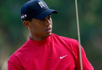PONTE VEDRA BEACH, FL - MAY 10:  Tiger Woods reacts to a missed putt on the 12th hole during the final round of THE PLAYERS Championship on THE PLAYERS Stadium Course at TPC Sawgrass on May 10, 2009 in Ponte Vedra Beach, Florida.  (Photo by Jamie Squire/Getty Images)