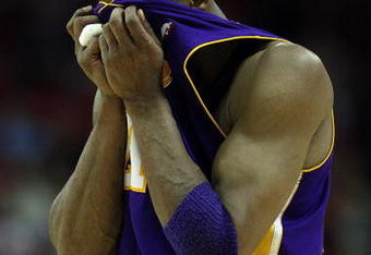 HOUSTON - MAY 14:  Guard Kobe Bryant #24 of the Los Angeles Lakers wipes his face during play against the Houston Rockets in Game Six of the Western Conference Semifinals during the 2009 NBA Playoffs at Toyota Center on May 14, 2009 in Houston, Texas. NOTE TO USER: User expressly acknowledges and agrees that, by downloading and or using this photograph, User is consenting to the terms and conditions of the Getty Images License Agreement.  (Photo by Ronald Martinez/Getty Images)