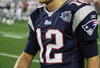 GLENDALE, AZ - FEBRUARY 03:  Tom Brady #12 of the New England Patriots walks off the field after connecting with Randy Moss for a touchdown in the fourth quarter against the New York Giants during Super Bowl XLII on February 3, 2008 at the University of Phoenix Stadium in Glendale, Arizona.  (Photo by Streeter Lecka/Getty Images)