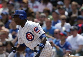 CHICAGO - MAY 2:  Alfonso Soriano #12 of the Chicago Cubs runs to first against the Florida Marlins during the game on May 2, 2009 at Wrigley Field in Chicago, Illinois. (Photo by Jonathan Daniel/Getty Images) 