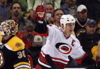 BOSTON - MAY 14:  Rod Brind'Amour #17 of the Carolina Hurricanes celebrates his goal as Tim Thomas #30 of the Boston Bruins looks on during Game Seven of the Eastern Conference Semifinal Round of the 2009 Stanley Cup Playoffs on May 14, 2009 at the TD Banknorth Garden in Boston, Massachusetts. The Hurricanes defeated the Bruins 3-2 in overtime.  (Photo by Elsa/Getty Images)