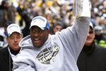 PITTSBURGH - FEBRUARY 03:  James Harrison #92 of the Pittsburgh Steelers shows off the Super Bowl XLIII trophy during a parade on February 3, 2009 in Pittsburgh, Pennsylvania.  (Photo by Gregory Shamus/Getty Images)