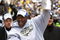 PITTSBURGH - FEBRUARY 03:  James Harrison #92 of the Pittsburgh Steelers shows off the Super Bowl XLIII trophy during a parade on February 3, 2009 in Pittsburgh, Pennsylvania.  (Photo by Gregory Shamus/Getty Images)