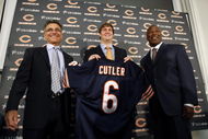 LAKE FOREST, IL - APRIL 3:  Chicago Bears general manager Jerry Angelo, quarterback Jay Cutler and head coach Lovie Smith are all smiles after introducing Cutler as their new quarterback during a press conference on April 3, 2009 at Halas Hall in Lake Forest, Illinois. (Photo by Jim Prisching/Getty Images)