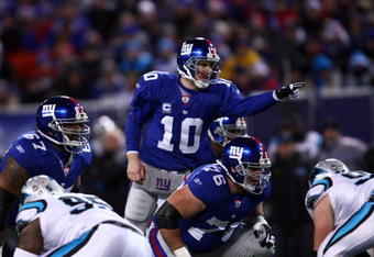 EAST RUTHERFORD, NJ - DECEMBER 21:  Quarterback Eli Manning #10 of the New York Giants signals before the snap against the Carolina Panthers on December 21, 2008 at Giants Stadium in East Rutherford, New Jersey.  (Photo by Chris McGrath/Getty Images)