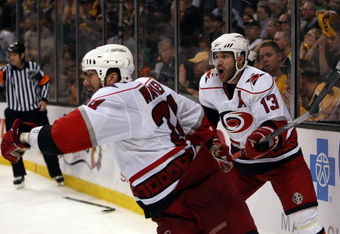 BOSTON - MAY 14:  Scott Walker #24 and Ray Whitney #13 of the Carolina Hurricanes celebrate Walker's game winning goal in overtime against the Boston Bruins during Game Seven of the Eastern Conference Semifinal Round of the 2009 Stanley Cup Playoffs on May 14, 2009 at the TD Banknorth Garden in Boston, Massachusetts. The Hurricanes defeated the Bruins 3-2 in overtime. (Photo by Elsa/Getty Images)