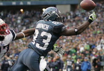 SEATTLE - DECEMBER 07:  Wide receiver Deion Branch #83 of the Seattle Seahawks makes a touchdown catch against Ellis Hobbs #27 of the New England Patriots on December 7, 2008 at Qwest Field in Seattle, Washington. The Patriots defeated the Seahawks 24-21. (Photo by Otto Greule Jr/Getty Images)