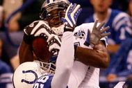 INDIANAPOLIS - DECEMBER 14: Calvin Johnson #81 of the Detroit Lions makes a catch over Kelvin Hayden #26 of the Indianapolis Colts on December 14, 2008 at Lucas Oil Stadium in Indianapolis, Indiana. The Colts defeated the Lions 31-21. (Photo by Chris Graythen/Getty Images)