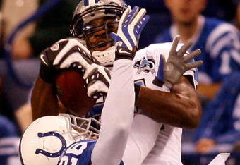INDIANAPOLIS - DECEMBER 14:  Calvin Johnson #81 of the Detroit Lions makes a catch over Kelvin Hayden #26 of the Indianapolis Colts on December 14, 2008 at Lucas Oil Stadium in Indianapolis, Indiana.  The Colts defeated the Lions 31-21.  (Photo by Chris Graythen/Getty Images)