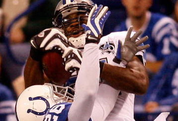 INDIANAPOLIS - DECEMBER 14:  Calvin Johnson #81 of the Detroit Lions makes a catch over Kelvin Hayden #26 of the Indianapolis Colts on December 14, 2008 at Lucas Oil Stadium in Indianapolis, Indiana.  The Colts defeated the Lions 31-21.  (Photo by Chris Graythen/Getty Images)