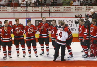EAST RUTHERFORD, NJ - FEBRUARY 3:  Scott Stevens #4 hugs former teammate Viktor Kozlov #22 of the New Jersey Devils during Steven's jersey retirement ceremony before the game against the Carolina Hurricanes on February 3, 2006 at the Continental Airlines Arena in East Rutherford, New Jersey. The Devils won the game 3-0.  (Photo by Andy Marlin/Getty Images)