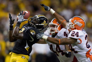 ST. LOUIS, MO - AUGUST 30: Jeremy Maclin #9 of the University of Missouri Tigers attempts to catch a pass against Brit Miller #44 and Bo Flowers #24 both of the University of Illinois Fighting Illini during the State Farm Arch Rivalry game at the Edward Jones Dome on August 30, 2008 in St. Louis, Missouri.  (Photo by Dilip Vishwanat/Getty Images)