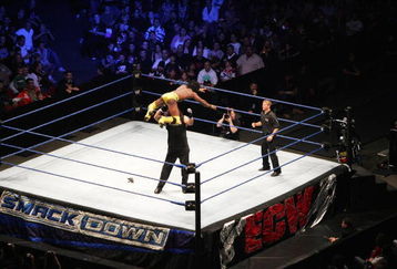 SYDNEY, AUSTRALIA - JUNE 15:  Kofi Kingston leaps from the turnbuckle against Chuck Palumbo during WWE Smackdown at Acer Arena on June 15, 2008 in Sydney, Australia.  (Photo by Gaye Gerard/Getty Images)