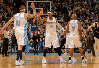 DENVER - MAY 03:  Chris Andersen #11, Carmelo Anthony #15 and Chauncey Billups #7 of the Denver Nuggets celebrate during a time out against the Dallas Mavericks in Game One of the Western Conference Semifinals during the 2009 NBA Playoffs at Pepsi Center on May 3, 2009 in Denver, Colorado. The Nuggets defeated the Mavericks 109-95. NOTE TO USER: User expressly acknowledges and agrees that, by downloading and or using this photograph, User is consenting to the terms and conditions of the Getty Images License Agreement.  (Photo by Doug Pensinger/Getty Images)