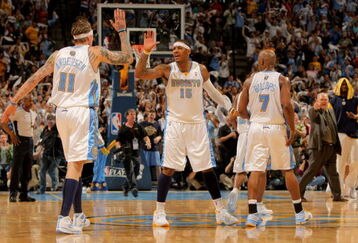 DENVER - MAY 03:  Chris Andersen #11, Carmelo Anthony #15 and Chauncey Billups #7 of the Denver Nuggets celebrate during a time out against the Dallas Mavericks in Game One of the Western Conference Semifinals during the 2009 NBA Playoffs at Pepsi Center on May 3, 2009 in Denver, Colorado. The Nuggets defeated the Mavericks 109-95. NOTE TO USER: User expressly acknowledges and agrees that, by downloading and or using this photograph, User is consenting to the terms and conditions of the Getty Images License Agreement.  (Photo by Doug Pensinger/Getty Images)