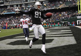 OAKLAND, CA - DECEMBER 21: Chaz Schilens #81 of the Oakland Raiders celebrates scoring a touchdown past Jacques Reeves #35 of the Houston Texans during an NFL game on December 21, 2008 at the Oakland-Alameda County Coliseum in Oakland, California.  (Photo by Jed Jacobsohn/Getty Images)