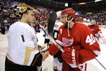 DETROIT - MAY 14:  Jonas Hiller #1 of the Anaheim Ducks shakes hands with Henrik Zetterberg #40 of the Detroit Red Wings after losing 4-3 in Game Seven of the Western Conference Semifinals of the 2009 NHL Stanley Cup Playoffs on May 14, 2009 at Joe Louis Arena in Detroit, Michigan.  (Photo by Gregory Shamus/Getty Images)