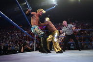 LAS VEGAS - DECEMBER 2:  (U.S. TABLOIDS OUT)   WWE wrestlers Rey Mysterio (in gold) and Chris Jericho perform on stage during the '1st Annual Video Game Awards' at the MGM Grand Garden Arena December 2, 2003 in Las Vegas, Nevada.  The show premieres on Spike T.V. Thursday, December 4 at 9:00PM ET/PT.  (Photo by Frank Micelotta/Getty Images)