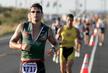 KONA, HI - OCTOBER 15:   Triathlete Lucas Marsak of Monroeville, PA runs during the Ford Ironman World Championship on October 15, 2005 in Kona, Hawaii.  Over 1800 athletes from all over the world participated in the 2005 Ironman.  (Photo by Marco Garcia/Getty Images).