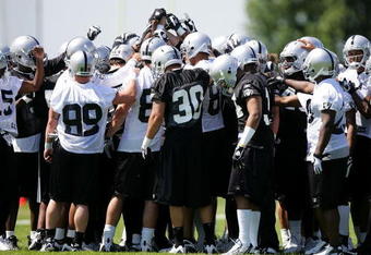 ALAMEDA, CA - MAY 08:  The Oakland Raiders huddle together during the Raiders minicamp at the team's permanent training facility on May 8, 2009 in Alameda, California.  (Photo by Ezra Shaw/Getty Images)