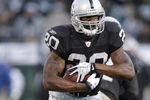 OAKLAND, CA - AUGUST 23:  Running back Darren McFadden #20 of the Oakland Raiders heads downfield against the Arizona Cardinals during a preseason game on August 23, 2008 at the McAfee Coliseum in Oakland, California.  (Photo by Greg Trott/Getty Images)