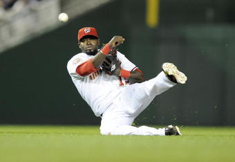 WASHINGTON - APRIL 23:  Cristian Guzman #15 of the Washington Nationals throws the ball to first base against the New York Mets April 23, 2008 at Nationals Park in Washington, DC.  (Photo by Greg Fiume/Getty Images)