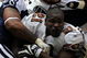 IRVING, TX - NOVEMBER 23:  Running back Frank Gore #21 of the San Francisco 49ers loses his helmet while tackled by Anthony Spencer #93 of the Dallas Cowboys at Texas Stadium on November 23, 2008 in Irving, Texas.  (Photo by Ronald Martinez/Getty Images)