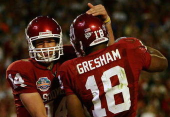 MIAMI - JANUARY 08:  Sam Bradford #14 of the Oklahoma Sooners celebrates with teammates Jermaine Gresham #18 after scoring a touchdown againist the Florida Gators during the FedEx BCS National Championship Game at Dolphin Stadium on January 8, 2009 in Miami, Florida.  (Photo by Donald Miralle/Getty Images)