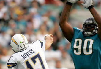 JACKSONVILLE, FL - NOVEMBER 18: Philip Rivers #17 of the San Diego Chargers throws a pass over Grady Jackson #90 of the Jacksonville Jaguars at Jacksonville Municipal Stadium on November 18, 2007 in Jacksonville, Florida. The Jaguars won the game 24-17.  (Photo by Sam Greenwood/Getty Images)