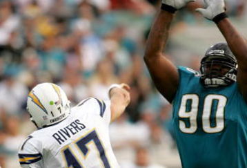 JACKSONVILLE, FL - NOVEMBER 18: Philip Rivers #17 of the San Diego Chargers throws a pass over Grady Jackson #90 of the Jacksonville Jaguars at Jacksonville Municipal Stadium on November 18, 2007 in Jacksonville, Florida. The Jaguars won the game 24-17.  (Photo by Sam Greenwood/Getty Images)