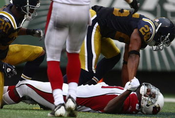 EAST RUTHERFORD, NJ - SEPTEMBER 28: Anquan Boldin #81 of the Arizona Cardinals lays on the field after colliding heavily with Eric Smith #33 of the New York Jets on September 28, 2008 at Giants Stadium in East Rutherford, New Jersey.  (Photo by Chris McGrath/Getty Images)