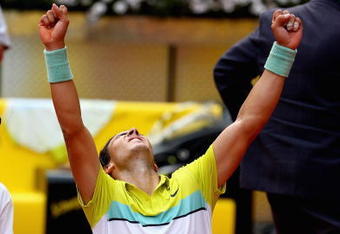 MADRID, SPAIN - MAY 16:  Rafael Nadal of Spain celebrates on his knees after match point against Novak Djokovic of Serbia in their semi-final during the Madrid Open tennis tournament at the Caja Magica on May 16, 2009 in Madrid, Spain.  (Photo by Clive Brunskill/Getty Images)