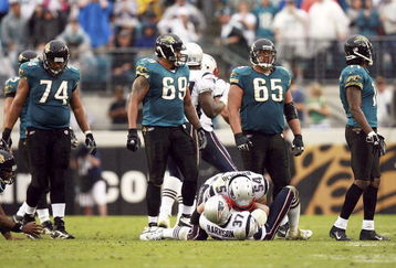 JACKSONVILLE, FL - DECEMBER 24:  Linebacker Tedy Bruschi #54 and Rodney Harrison #37 of the New England Patriots celebrate a fumble recovery by Harrison as offensive lineman Maurice Williams #74, Khalif Barnes #69 and Chris Naeole #65 of the Jacksonville Jaguars react on December 24, 2006 at Alltel Stadium in Jacksonville, Florida. The Patriots defeated the Jaguars 24-21.  (Photo by Doug Benc/Getty Images)