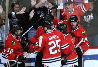 CHICAGO - MAY 11:  Martin Havlat #24 (R), Brian Campbell #51, Patrick Sharp #10 (L), Jonathan Toews #19 and Cam Barker #25 of the Chicago Blackhawks celebrate after Toews scored a power play goal in the third period against the Vancouver Canucks during Game Six of the Western Conference Semifinal Round of the 2009 Stanley Cup Playoffs on May 11, 2009 at the United Center in Chicago, Illinois. The Blackhawks won 7-5.  (Photo by Jonathan Daniel/Getty Images)