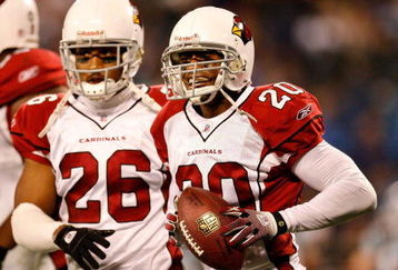CHARLOTTE, NC - JANUARY 10:  Ralph Brown #20 of the Arizona Cardinals celebrates his interception against the Carolina Panthers with teammate Roderick Hood #26 during the NFC Divisional Playoff Game on January 10, 2009 at Bank of America Stadium in Charlotte, North Carolina.  (Photo by Kevin C. Cox/Getty Images)