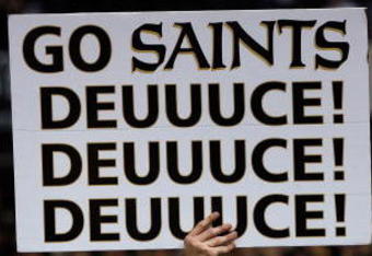 NEW ORLEANS - JANUARY 13:  A fan of the New Orleans Saints holds a sign that reads 'Go Saints Deuuuce!'  against the Philadelphia Eagles during the NFC divisional playoff game at the Superdome on January 13, 2007 in New Orleans, Louisiana.  (Photo by Chris Graythen/Getty Images)