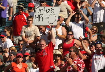 ANAHEIM, CA - MAY 14: An Angels fan holds up a sign reminding David Ortiz of the Boston Red Sox that he has no home runs for the year during the game with the Los Angeles Angels of Anaheim on May 14, 2009 at Angel Stadium in Anaheim, California.  The Angels won 5-4 in 12 innings.   (Photo by Stephen Dunn/Getty Images)