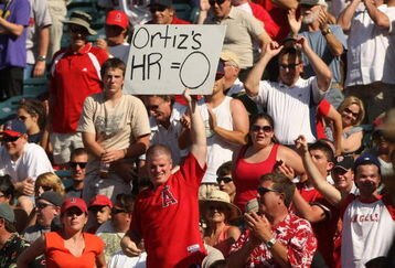 ANAHEIM, CA - MAY 14: An Angels fan holds up a sign reminding David Ortiz of the Boston Red Sox that he has no home runs for the year during the game with the Los Angeles Angels of Anaheim on May 14, 2009 at Angel Stadium in Anaheim, California.  The Angels won 5-4 in 12 innings.   (Photo by Stephen Dunn/Getty Images)