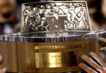 Chicago Bears players stretch for the George Halas trophy  after play against the New Orleans Saints in the NFC Championship game at Soldier Field in Chicago, Illinois on on January 21, 2007.  (Photo by Al Messerschmidt/Getty Images)