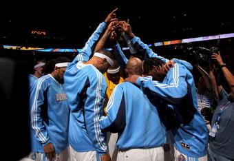 DENVER - MAY 13:  The Denver Nuggets huddle during player introductions before facing the Dallas Mavericks in Game Five of the Western Conference Semifinals during the 2009 NBA Playoffs at Pepsi Center on May 13, 2009 in Denver, Colorado.  The Nuggets defeated the Mavericks 124-110 to advance to the Western Conference Finals.  NOTE TO USER: User expressly acknowledges and agrees that, by downloading and or using this photograph, User is consenting to the terms and conditions of the Getty Images License Agreement.  (Photo by Doug Pensinger/Getty Images)