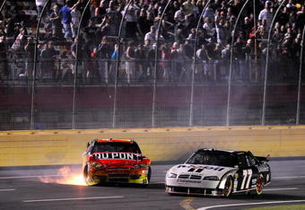 CONCORD, NC - MAY 16:  Jeff Gordon, driver of the #24 DuPont Chevrolet, sits on the track after spinning out of control during the NASCAR Sprint All-Star Race on May 16, 2009 at Lowe's Motor Speedway in Concord, North Carolina.  (Photo by John Harrelson/Getty Images)