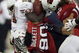 GLENDALE, AZ - NOVEMBER 10:  Frank Gore #21 of the San Francisco 49ers is stopped by Darnell Dockett #90 and Travis LaBoy #55 of the Arizona Cardinals during the third quarter at University of Phoenix Stadium on November, 10 2008 in Glendale, Arizona.  (Photo by Harry How/Getty Images)