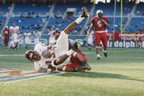 PHILADELPHIA - NOVEMBER 10:  Wide receiver Ernest Wilford #19 of the Virginia Tech Hokies makes a catch in front of cornerback Yazid Jackson #26 of the Temple Owls during the Big East Conference football game on November 10, 2001 at Veterans Stadium in Philadelphia, Pennsylvania. Virginia Tech defeated Temple 35-0 . (Photo by Doug Pensinger/Getty Images)
